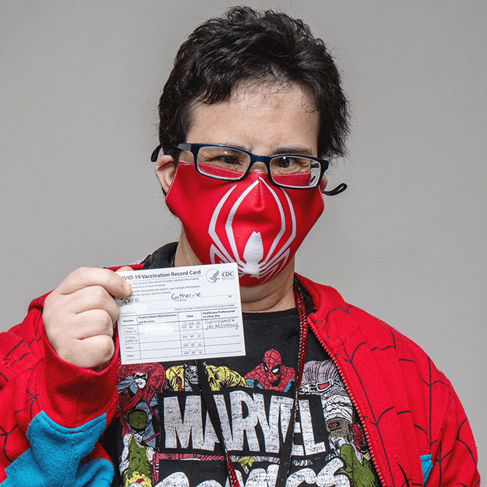 STC Member Catherine Spero proudly displays her vaccination card