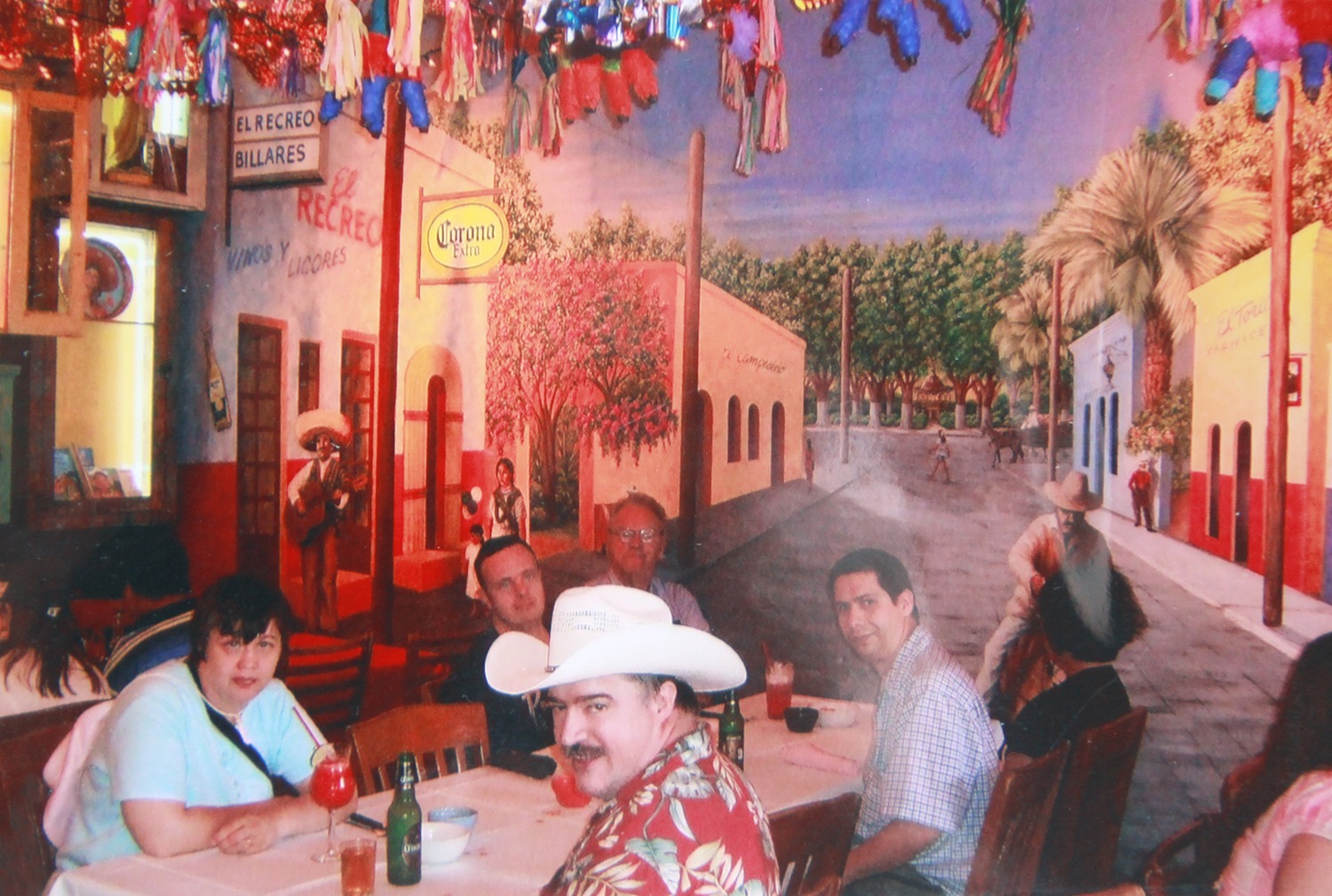 Janet and Chris out to dinner at a Mexican restaurant during their honeymoon vacation