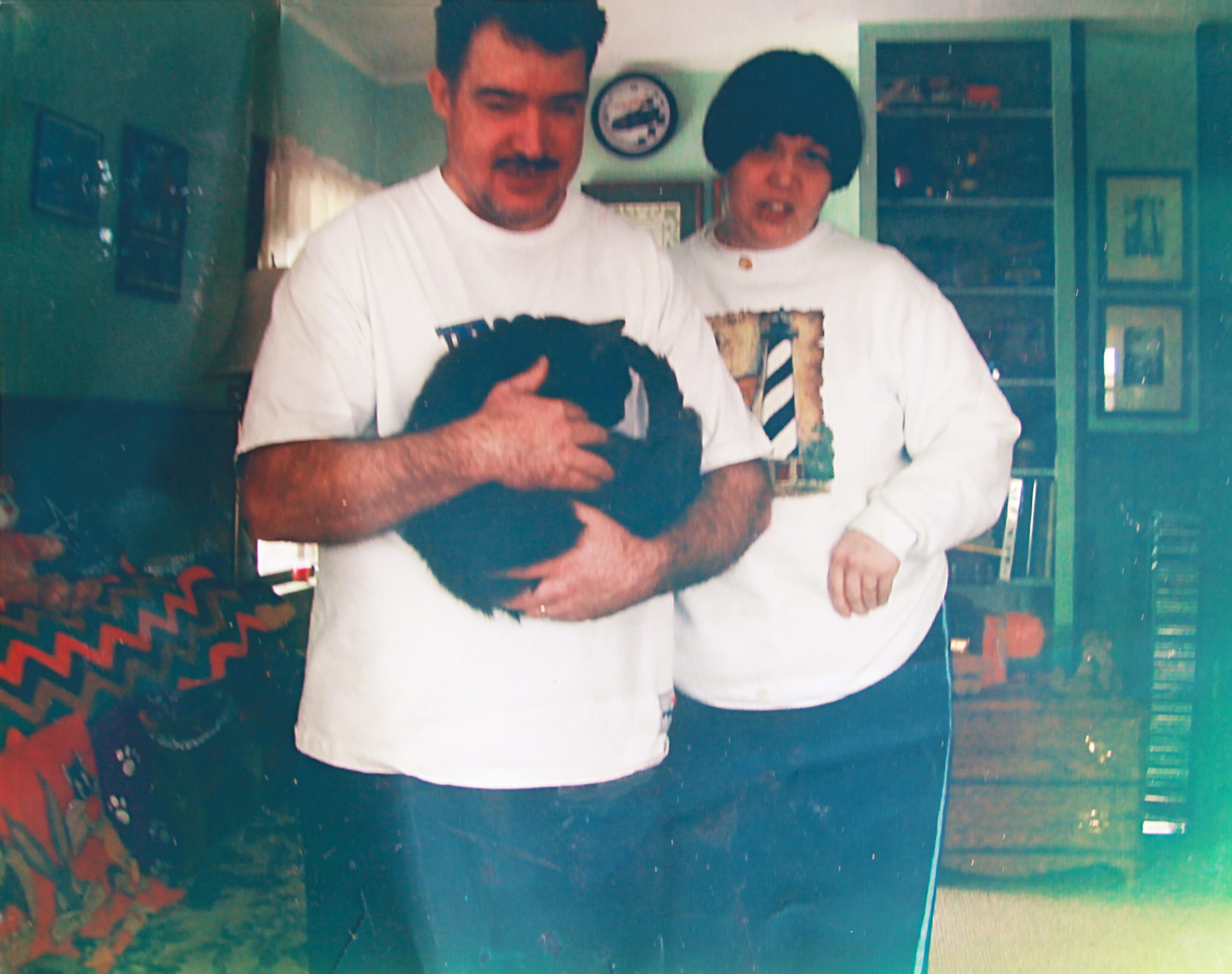 Janet and Chris in their first apartment with their cat, Levi