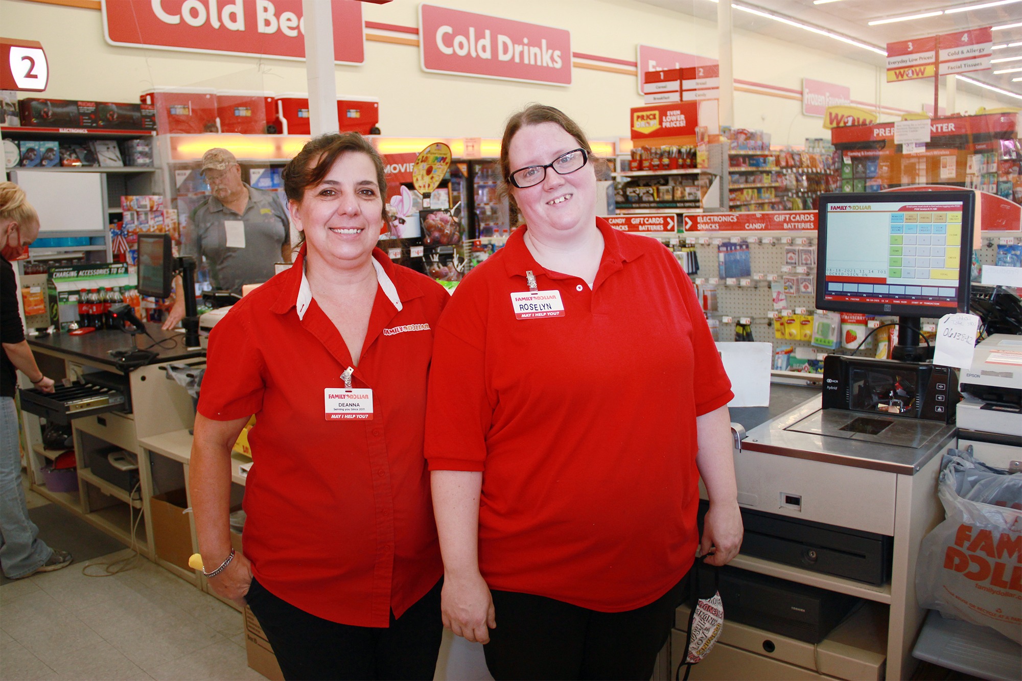 Roselyn Hathaway stands behind the front counter at her job at the Dollar General in Sidney