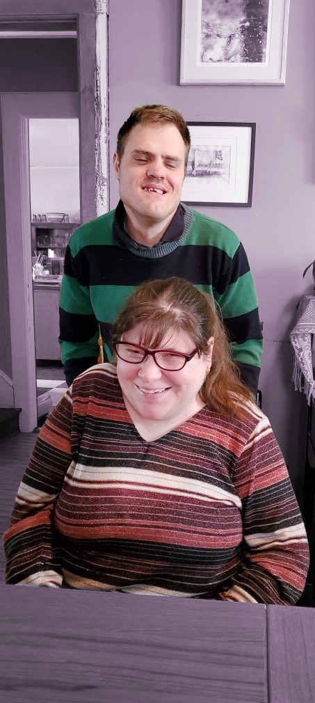 Will and Deidre pose in their house together